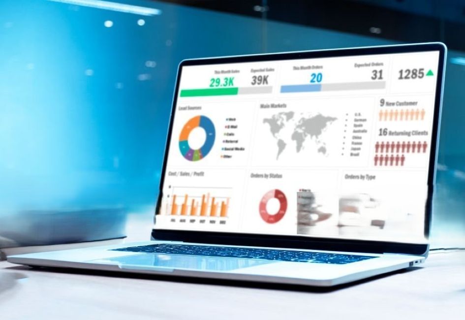Laptop showing analytics dashboard with charts and key metrics