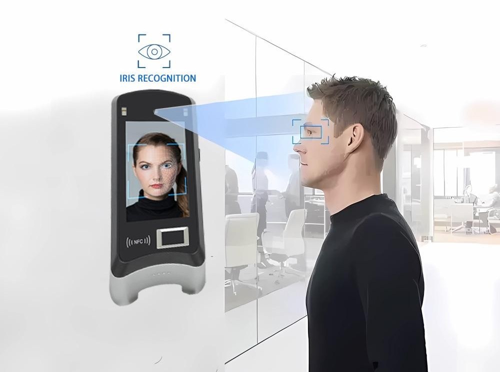 Employee using an iris recognition scanner to record attendance
