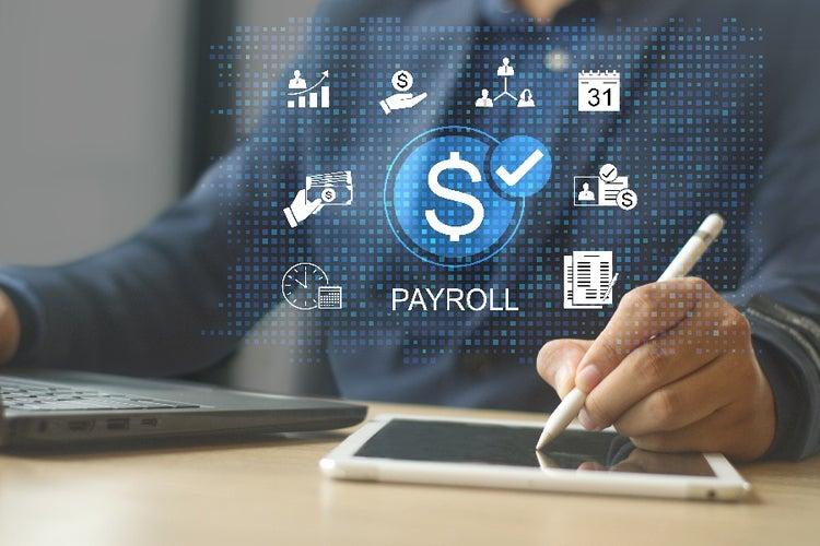 HR professional running automated payroll with digital payroll icons