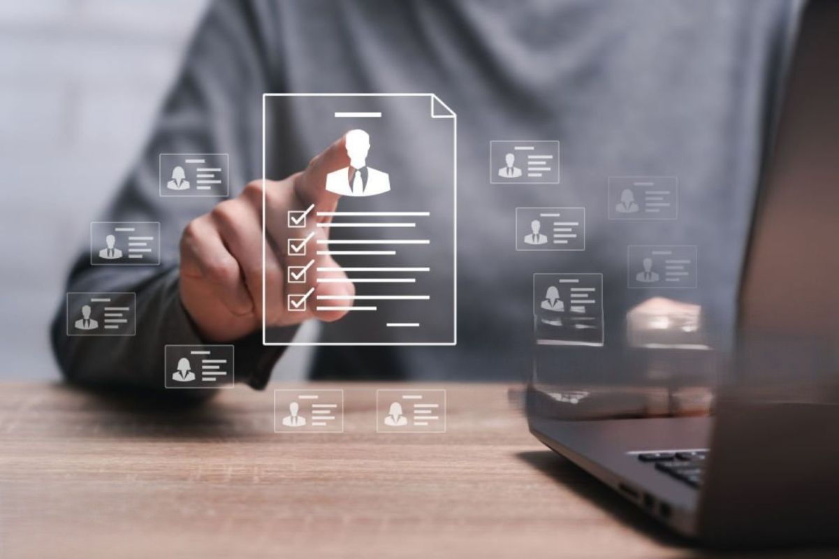 Recruiter screening digital candidate resumes and profile cards